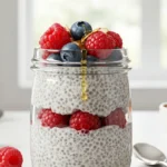 Delicious homemade chia pudding topped with berries and nuts.